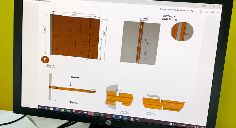 Écran affichant les plans techniques et les détails d’assemblage d’un ouvrage sur mesure en acier Corten.